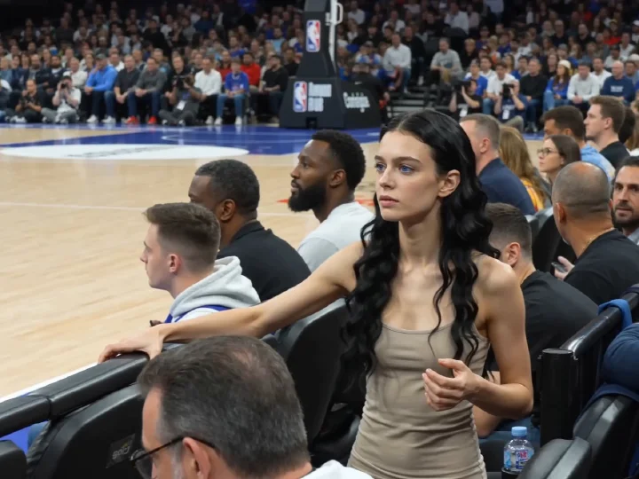 @sophia watching an nba game courtside, shot from another camera
